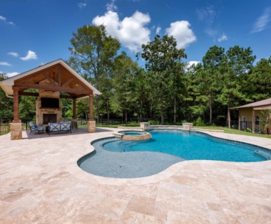 garden with a fireplace and swimming pool