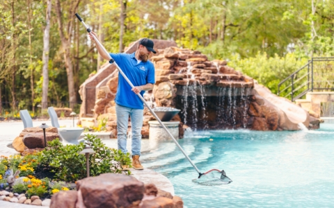 a person maintaining a swimming pool