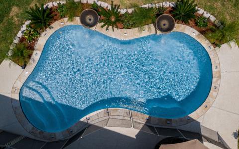 Aerial view of two fountains dumping into a bean shaped pool
