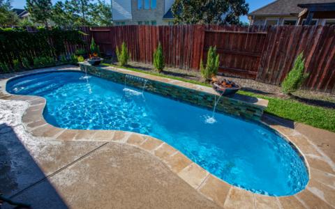 Two fire pit fountains pouring into skinny pool
