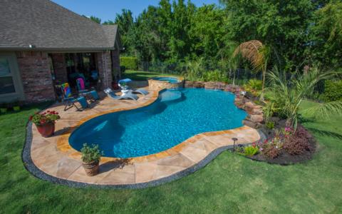 Tropical outdoor area bordering a pool
